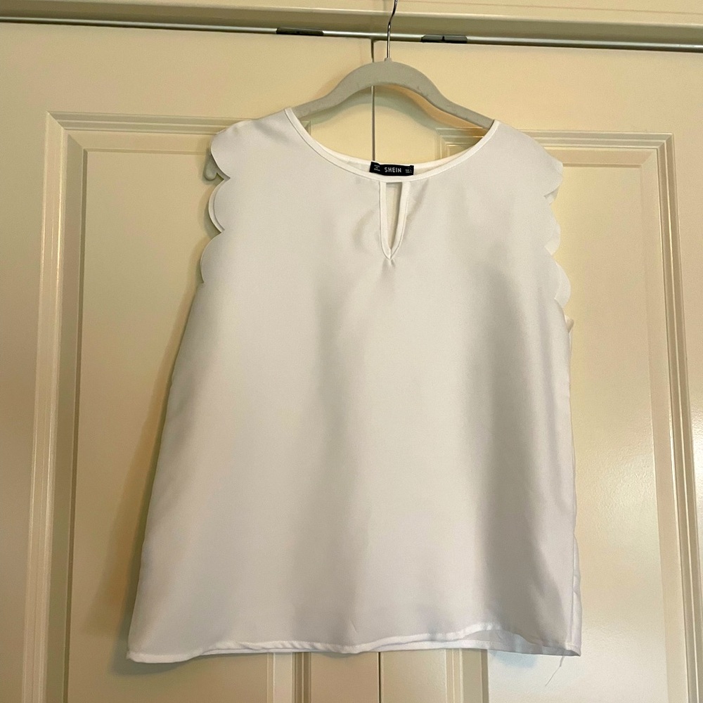 White chiffon tank with scallop edges on the arm openings